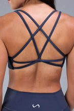 Back View of Blue TLF Tempo Strappy Back Sports Bra, featuring a minimal design for the gym and lifestyle wear 