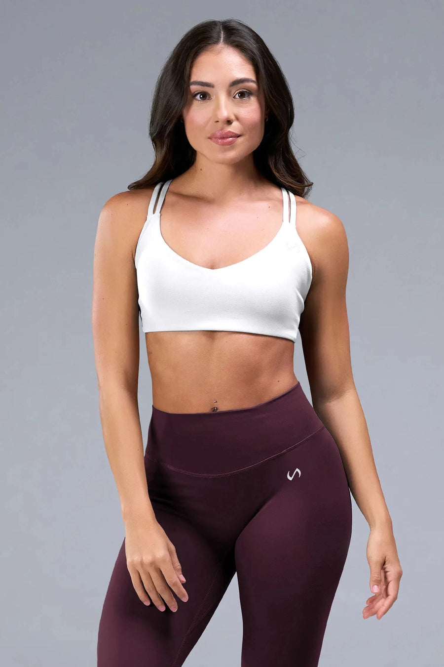 Back View of White TLF Tempo Strappy Back Sports Bra, featuring a minimal design for the gym and lifestyle wear 