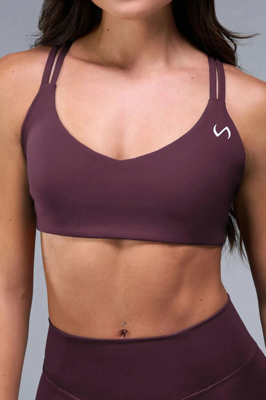 Front View of Wine TLF Tempo Strappy Back Sports Bra, featuring a minimal design for the gym and lifestyle wear 