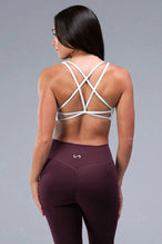 Front View of White TLF Tempo Strappy Back Sports Bra, featuring a minimal design for the gym and lifestyle wear 