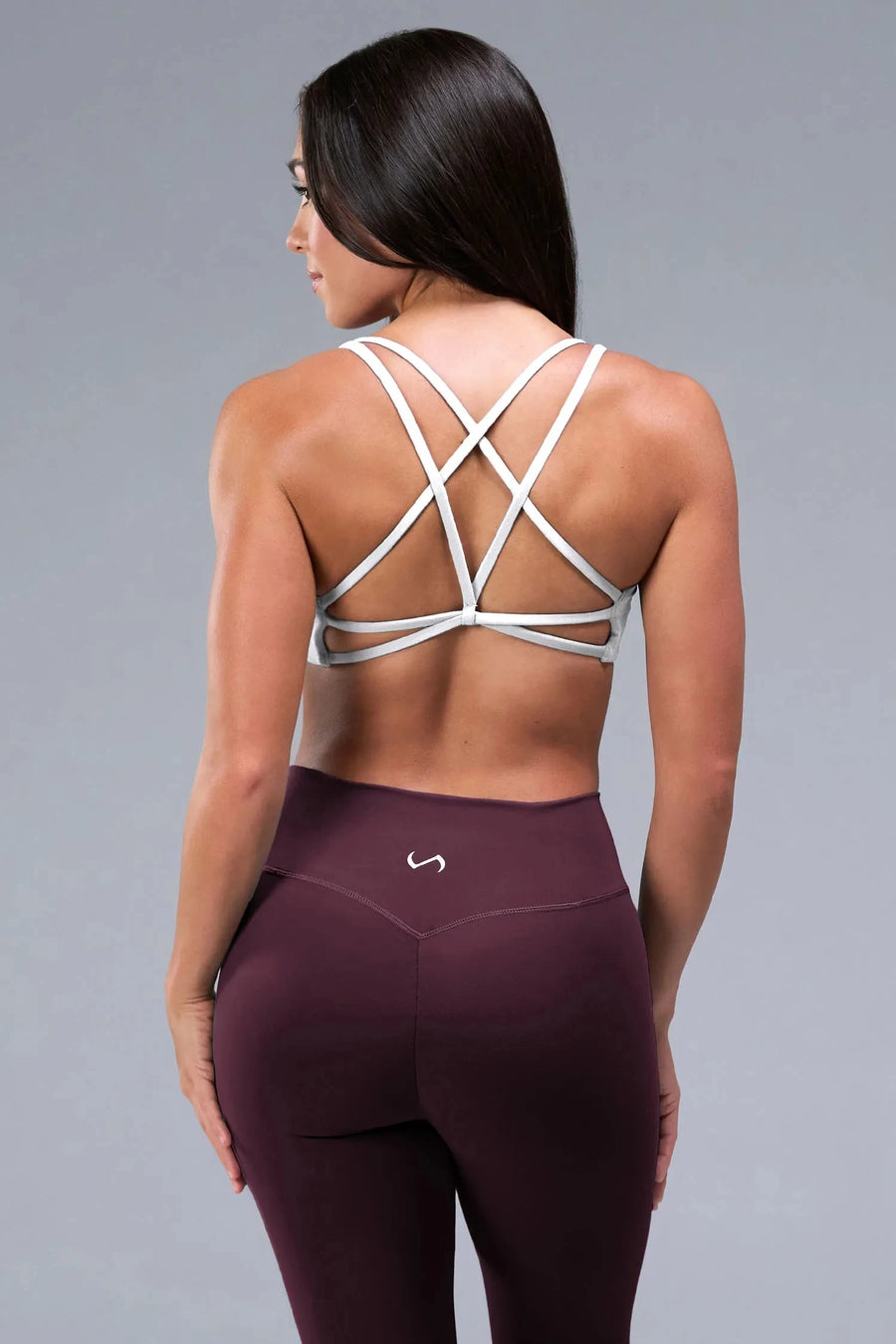 Front View of White TLF Tempo Strappy Back Sports Bra, featuring a minimal design for the gym and lifestyle wear 