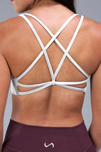 Back View of White TLF Tempo Strappy Back Sports Bra, featuring a minimal design for the gym and lifestyle wear 