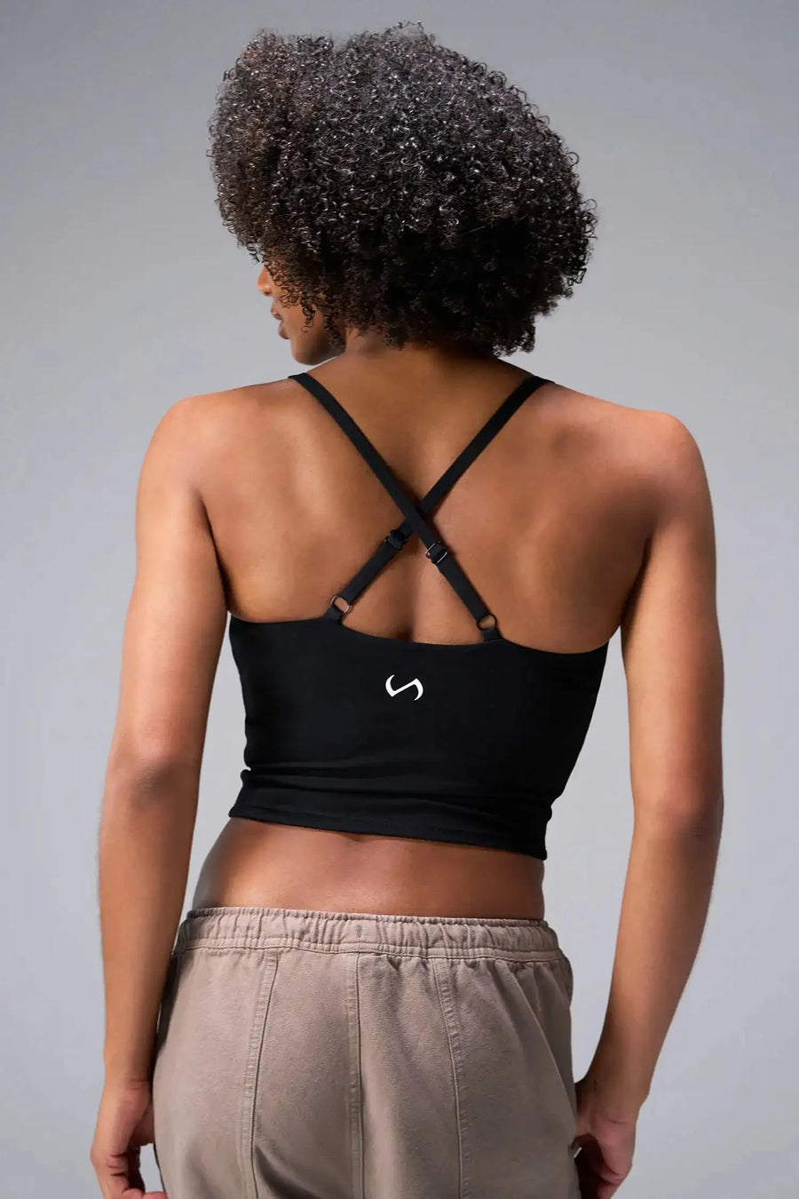 Back View Of Tempo Tank Bra in Black, provides the support and flexibility you need to perform and look your best.