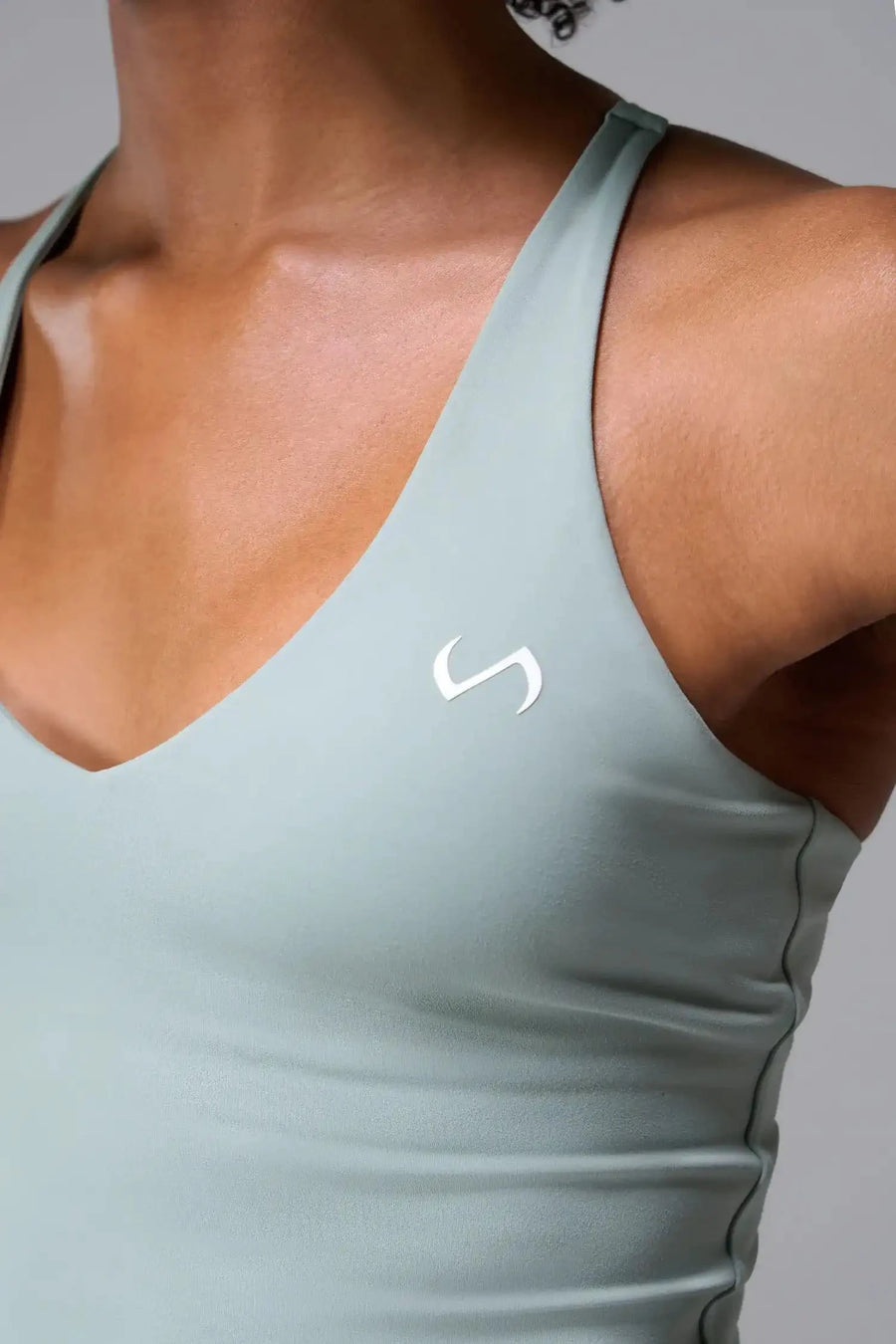 Front View Of Tempo Tank Bra in Sage Green, provides the support and flexibility you need to perform and look your best.