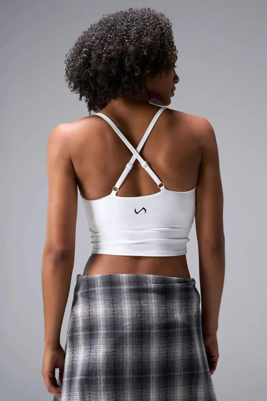 Back View Of Tempo Tank Bra in White, provides the support and flexibility you need to perform and look your best.