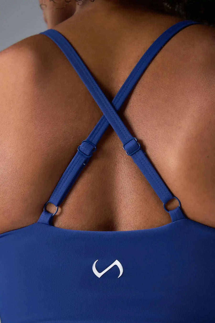 Back View Of Tempo Tank Bra in Oxford, provides the support and flexibility you need to perform and look your best.