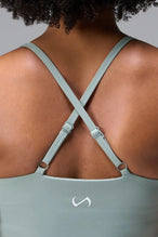 Back View Of Tempo Tank Bra in Sage Green, provides the support and flexibility you need to perform and look your best.