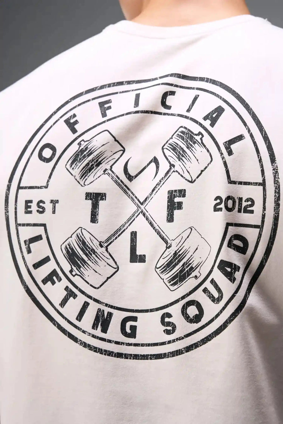 Back View of Oatmilk TLF Cross weights Swole Tee featuring our swole fit and custom graphic print design on center back
