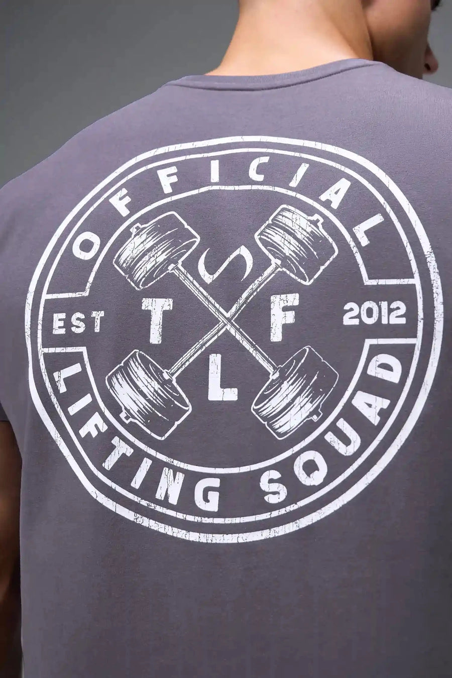 Back View of Purple TLF Cross weights Swole Tee featuring our swole fit and custom graphic print design on center back