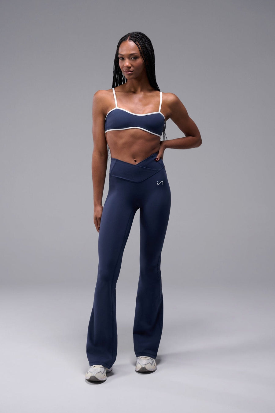 Front View of Blue TLF Tempo Flare Leggings, featuring a waist snatching crossover waistband and glute shaping side seam 