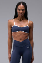 Front View of Blue Tempo Minimal Bralette 2.0, featuring removable pads and adjustable straps for low impact all day wear