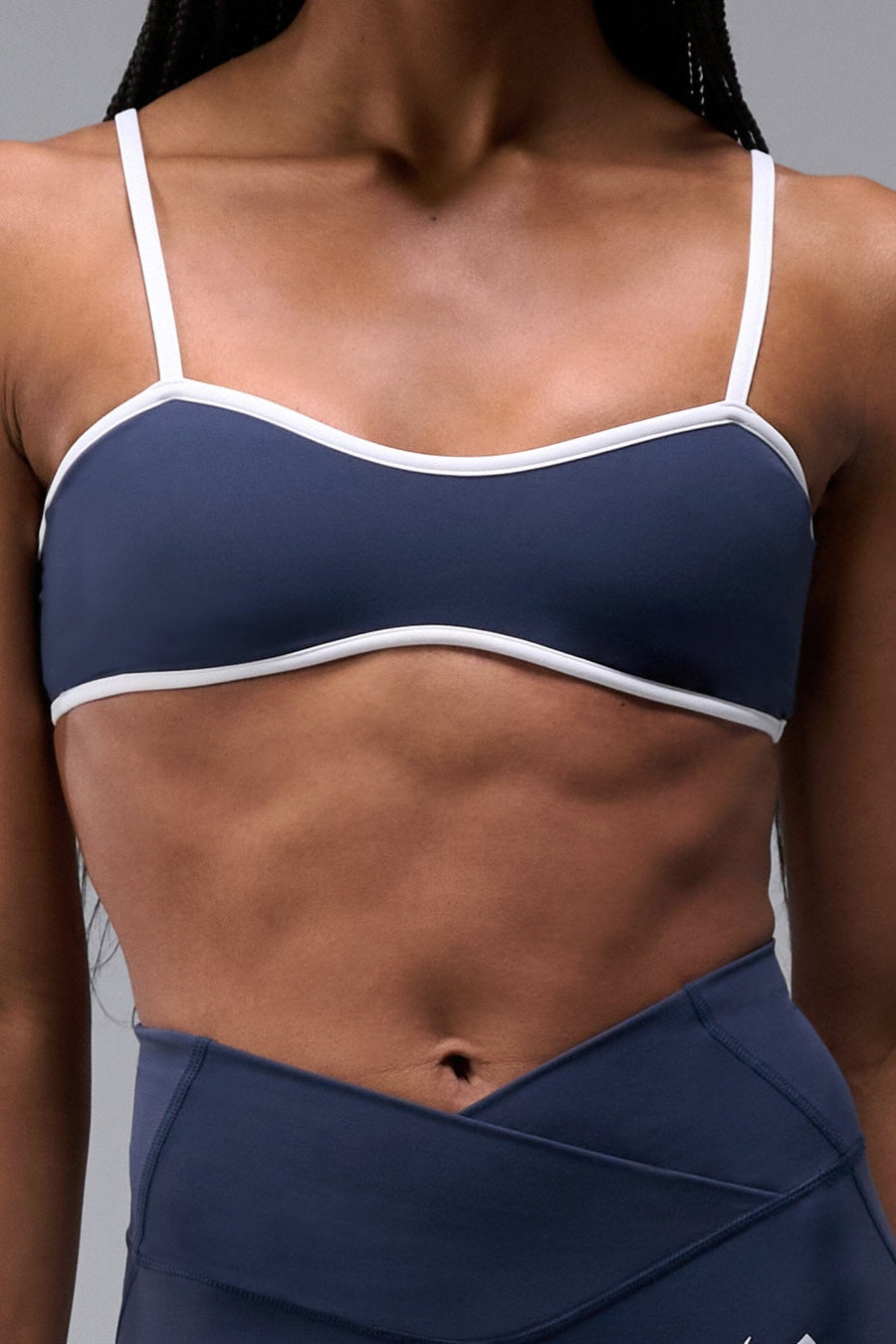 Front View of Blue Tempo Minimal Bralette 2.0, featuring removable pads and adjustable straps for low impact all day wear