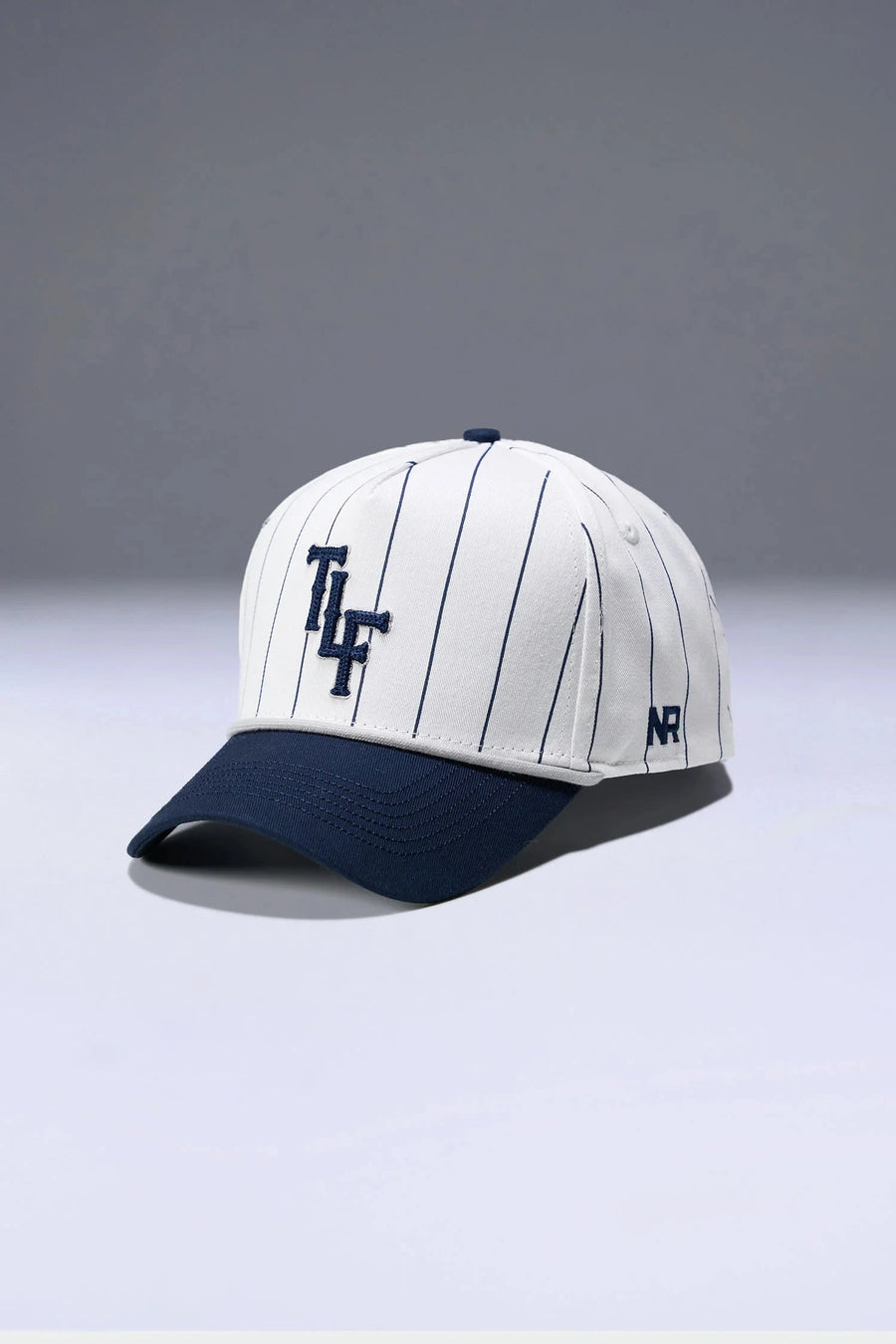 Front View Of TLF x NR Snapback Pinstripe Hat in White And Blue Color