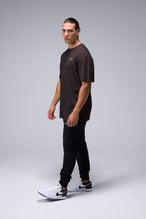 Left Side View Of Black Stonewash TLF TM Dura Cotton Oversized Tee
