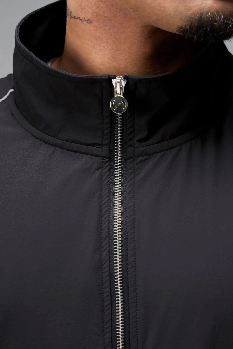 Front View of Black TLF Track Jacket (Men’s GTS Gym-To-Street Edition) with mesh lining, reflective piping, and premium trims for all-day Gym-To-Street wear. 