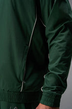 Detail View of Green TLF Track Jacket (Men’s GTS Gym-To-Street Edition) with mesh lining, reflective piping, and premium trims for all-day Gym-To-Street wear. 