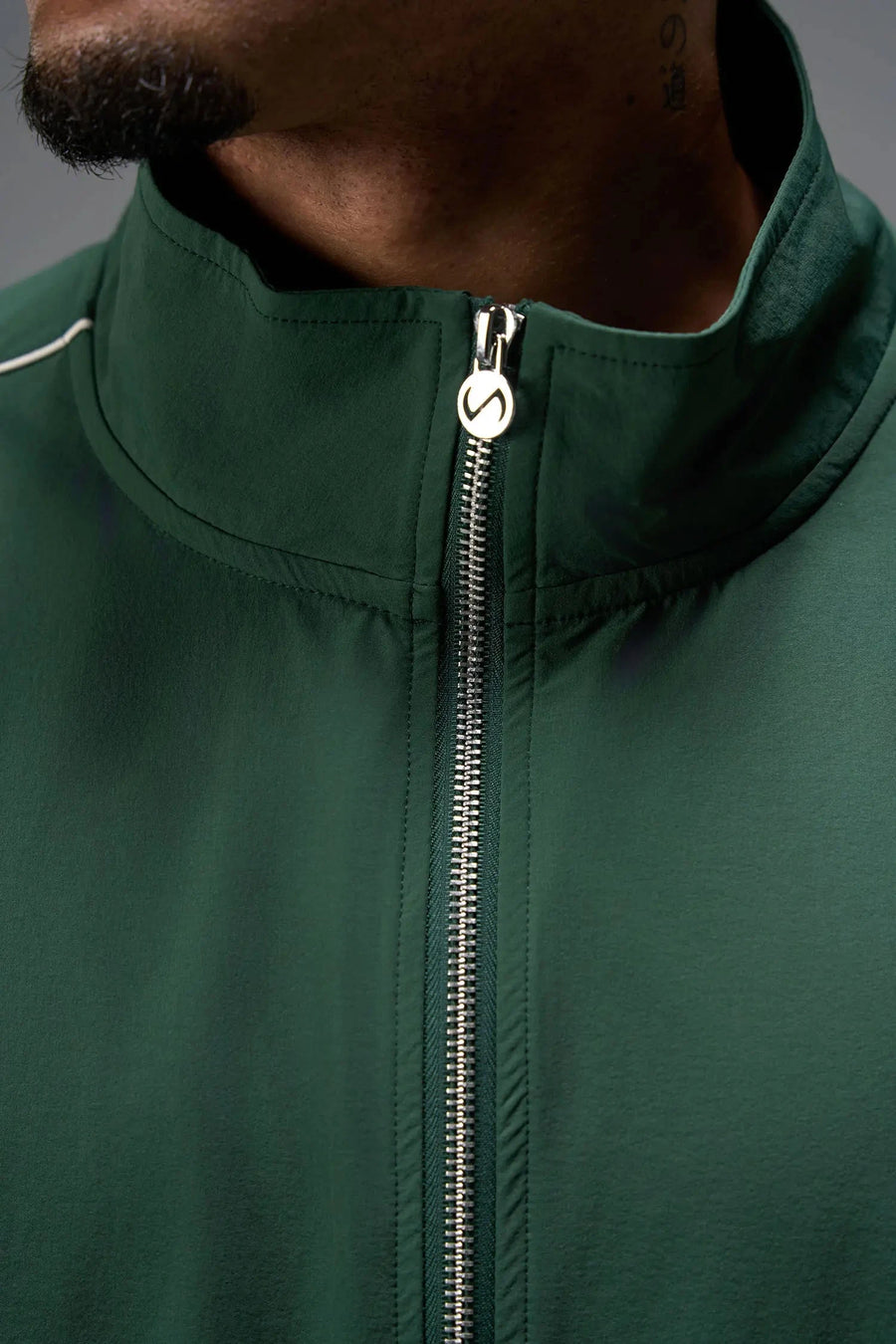 Front View of Green TLF Track Jacket (Men’s GTS Gym-To-Street Edition) with mesh lining, reflective piping, and premium trims for all-day Gym-To-Street wear. 