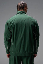 Back View of Green TLF Track Jacket (Men’s GTS Gym-To-Street Edition) with mesh lining, reflective piping, and premium trims for all-day Gym-To-Street wear. 