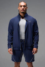 Front View of Blue TLF Track Jacket (Men’s GTS Gym-To-Street Edition) with mesh lining, reflective piping, and premium trims for all-day Gym-To-Street wear. 