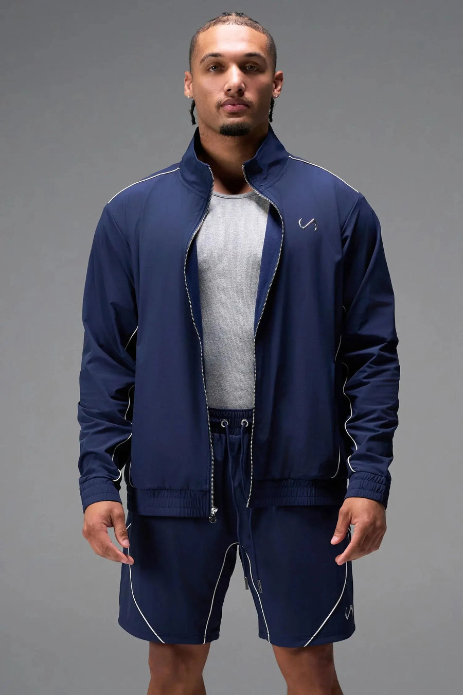 Front View of Blue TLF Track Jacket (Men’s GTS Gym-To-Street Edition) with mesh lining, reflective piping, and premium trims for all-day Gym-To-Street wear. 