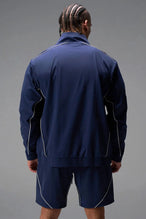Back View of Blue TLF Track Jacket (Men’s GTS Gym-To-Street Edition) with mesh lining, reflective piping, and premium trims for all-day Gym-To-Street wear. 