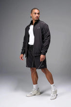Front View of Black TLF Track Jacket (Men’s GTS Gym-To-Street Edition) with mesh lining, reflective piping, and premium trims for all-day Gym-To-Street wear. 