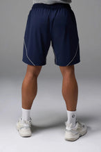 Back View of Blue TLF Track Shorts (Men’s GTS Gym-To-Street Edition) featuring side zipper pockets, mesh lining and reflective piping details.