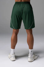 Back View of Green TLF Track Shorts (Men’s GTS Gym-To-Street Edition) featuring side zipper pockets, mesh lining and reflective piping details.