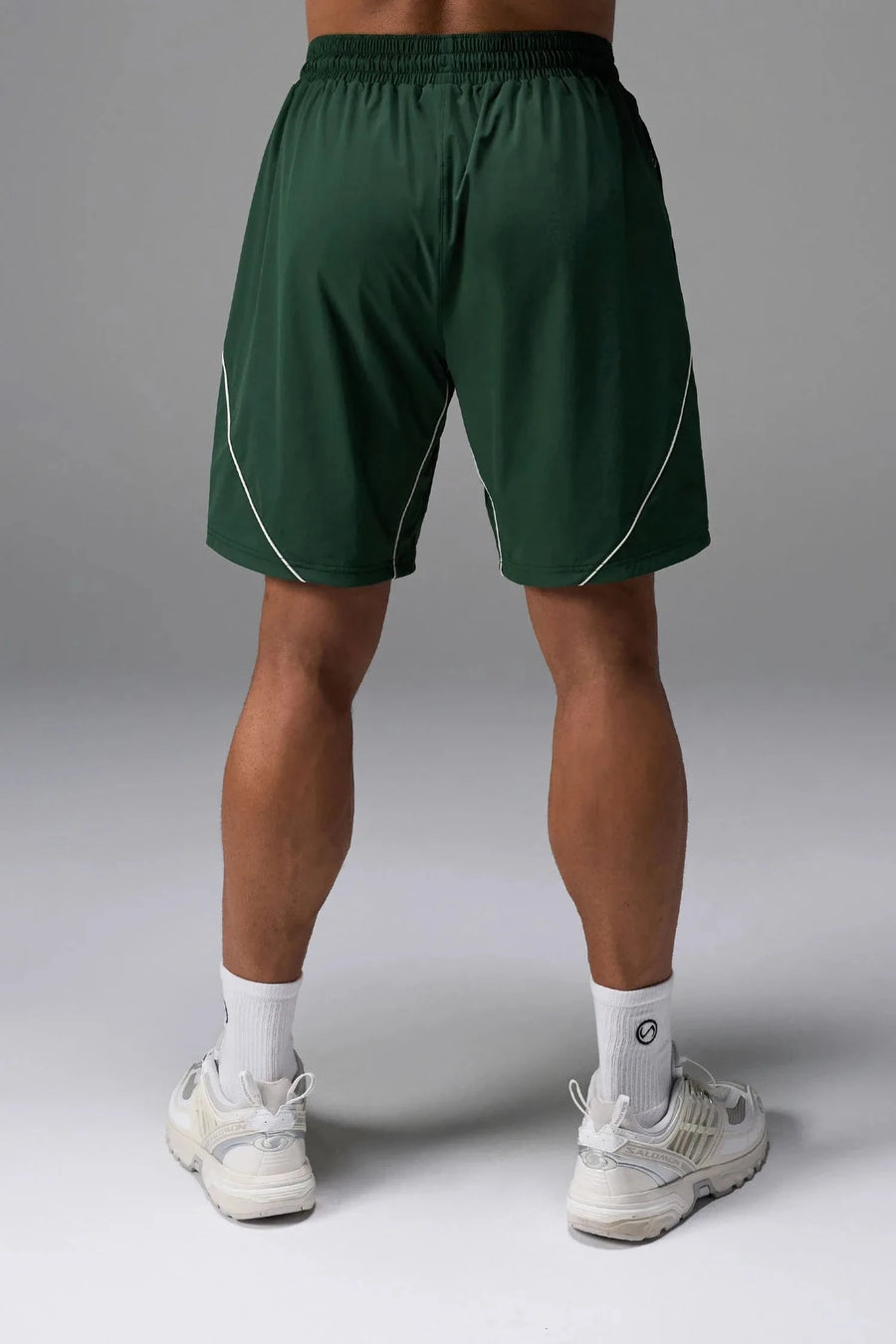 Back View of Green TLF Track Shorts (Men’s GTS Gym-To-Street Edition) featuring side zipper pockets, mesh lining and reflective piping details.