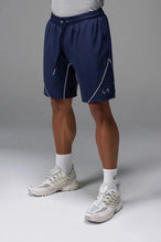 Front View of Blue TLF Track Shorts (Men’s GTS Gym-To-Street Edition) featuring side zipper pockets, mesh lining and reflective piping details.
