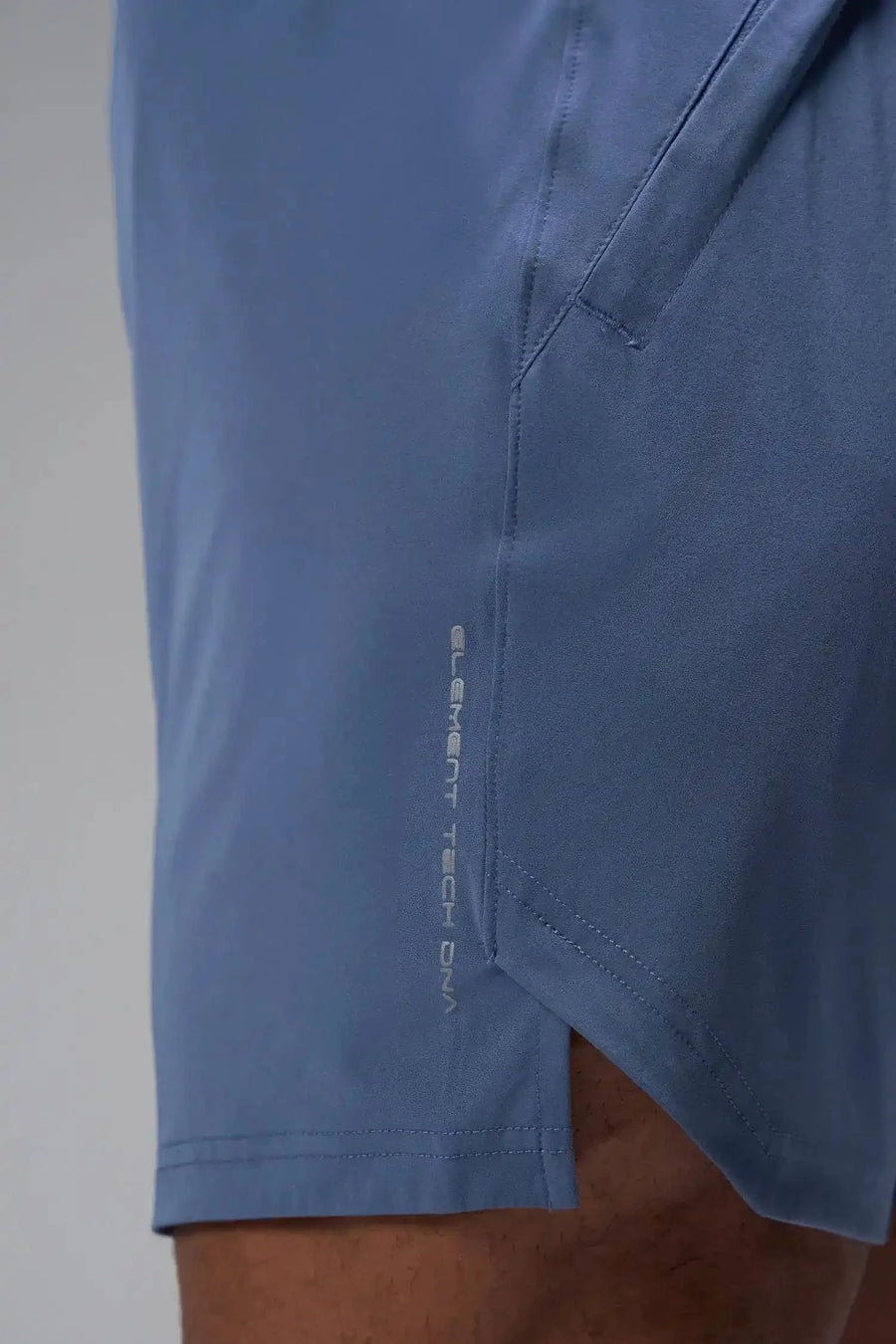 Detail Front View of Blue TLF Train Element 7 Inch Shorts featuring a 7 inch in seam and side zipper pockets designed for optimal performance