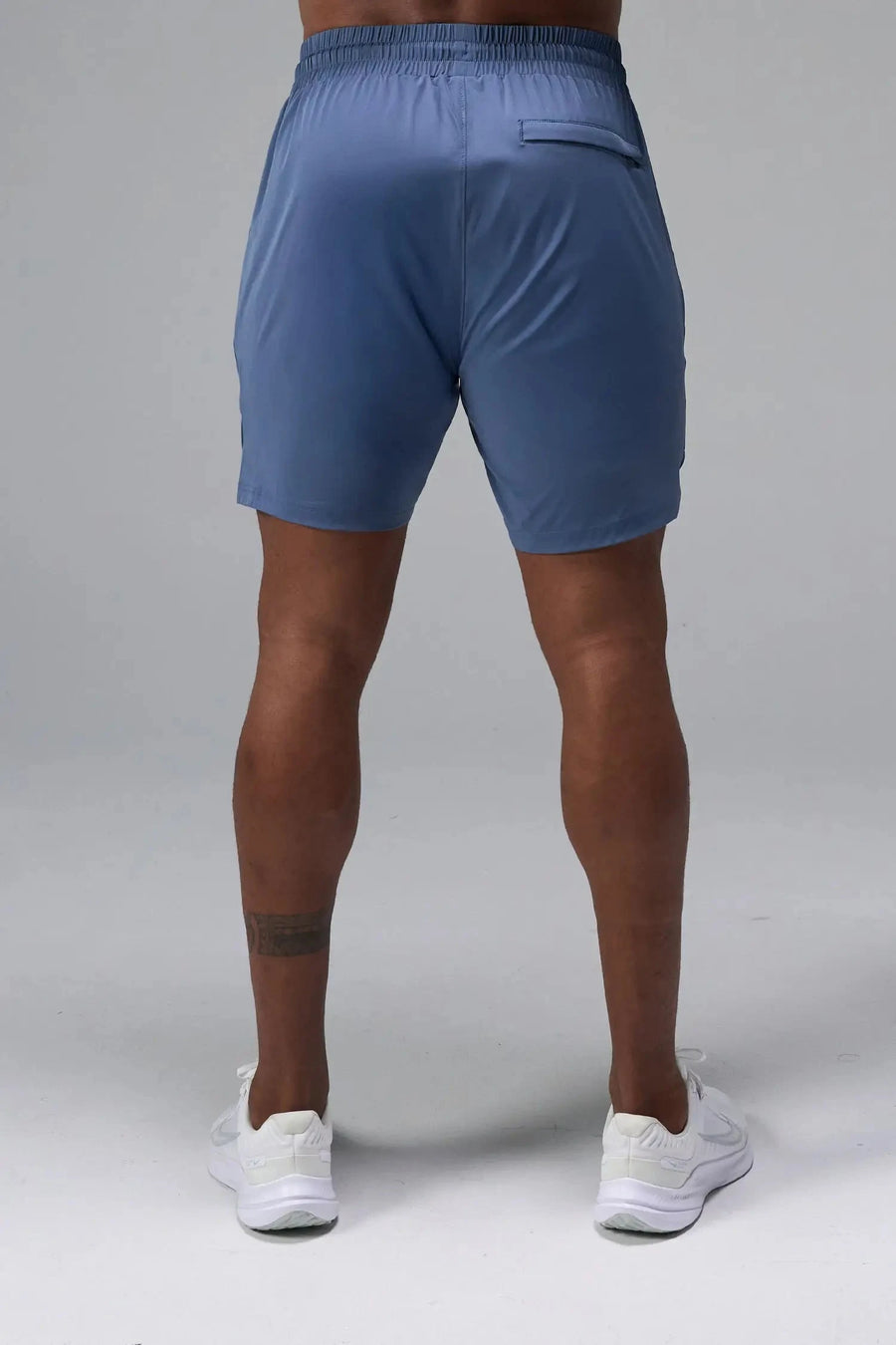Back View of Blue TLF Train Element 7 Inch Shorts featuring a 7 inch in seam and side zipper pockets designed for optimal performance