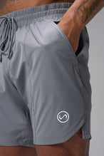 Detail View of Gray TLF Train Element 7 Inch Shorts featuring a 7 inch in seam and side zipper pockets designed for optimal performance