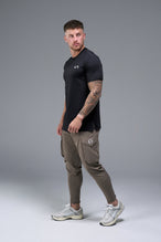 Side View of Brown TLF Train Element 7/8 Joggers 2.0, featuring side cargo pockets in an athletic 7/8 length and side zipper pockets 