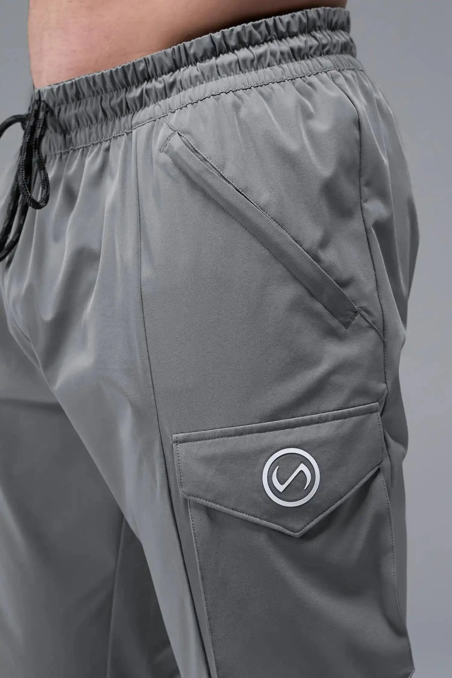 Detail Front View of Gray TLF Train Element 7/8 Joggers 2.0, featuring side cargo pockets in an athletic 7/8 length and side zipper pockets 