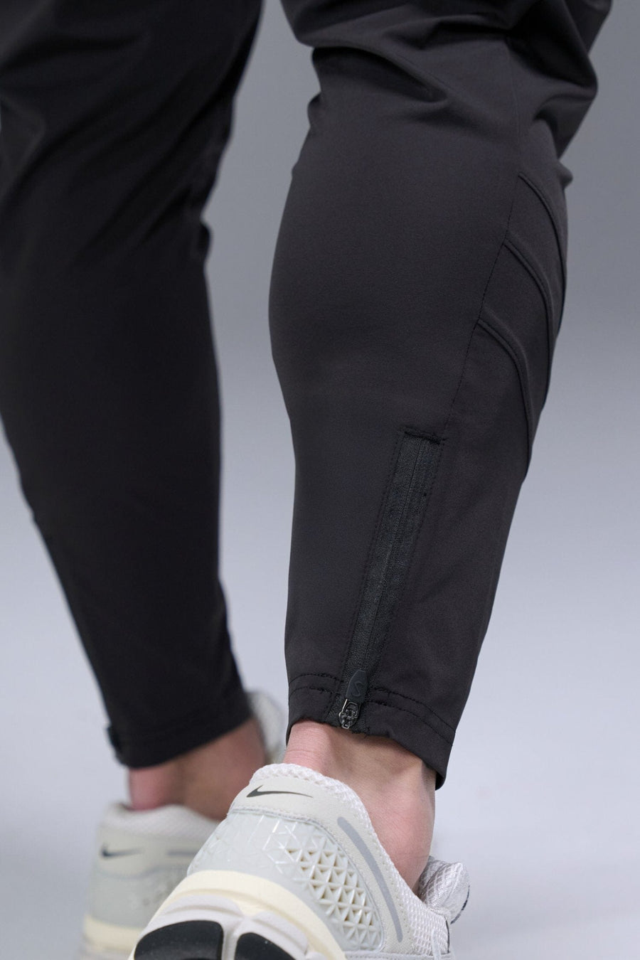 Detail Back View of Black TLF Train Element 7/8 Joggers 2.0, featuring side cargo pockets in an athletic 7/8 length and side zipper pockets 