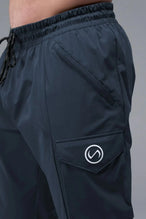 Detail Front View of Blue TLF Train Element 7/8 Joggers 2.0, featuring side cargo pockets in an athletic 7/8 length and side zipper pockets 
