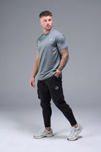 Side View of Black TLF Train Element 7/8 Joggers 2.0, featuring side cargo pockets in an athletic 7/8 length and side zipper pockets 