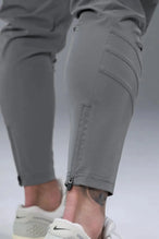 Side View of Gray TLF Train Element 7/8 Joggers 2.0, featuring side cargo pockets in an athletic 7/8 length and side zipper pockets 