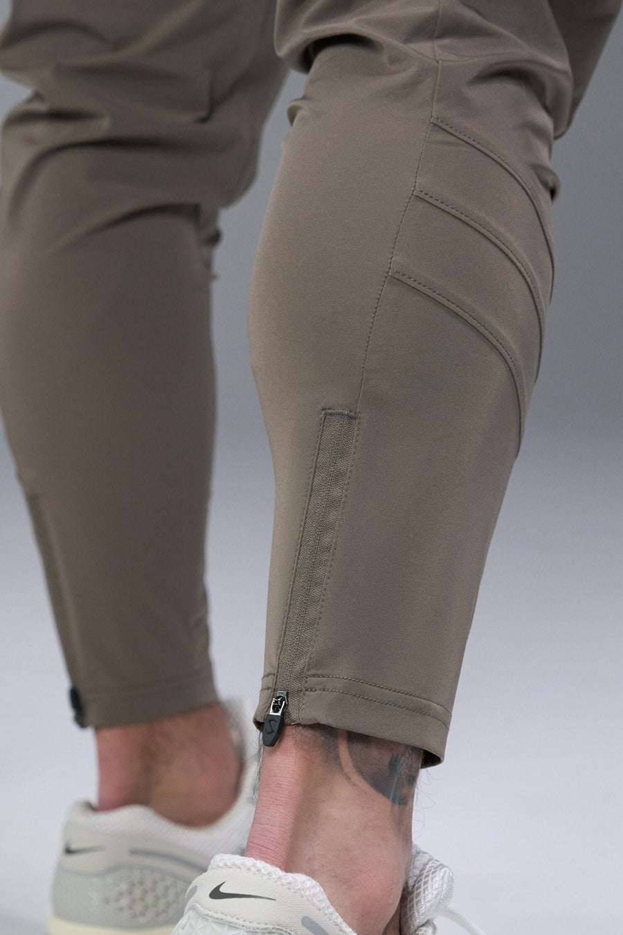 Detail Back View of Brown TLF Train Element 7/8 Joggers 2.0, featuring side cargo pockets in an athletic 7/8 length and side zipper pockets 