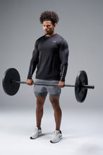 Front View of Black TLF Train Infi-Dry Long Sleeve, featuring our Infi-Dry fabric technology and reflective sleeve design for night running 