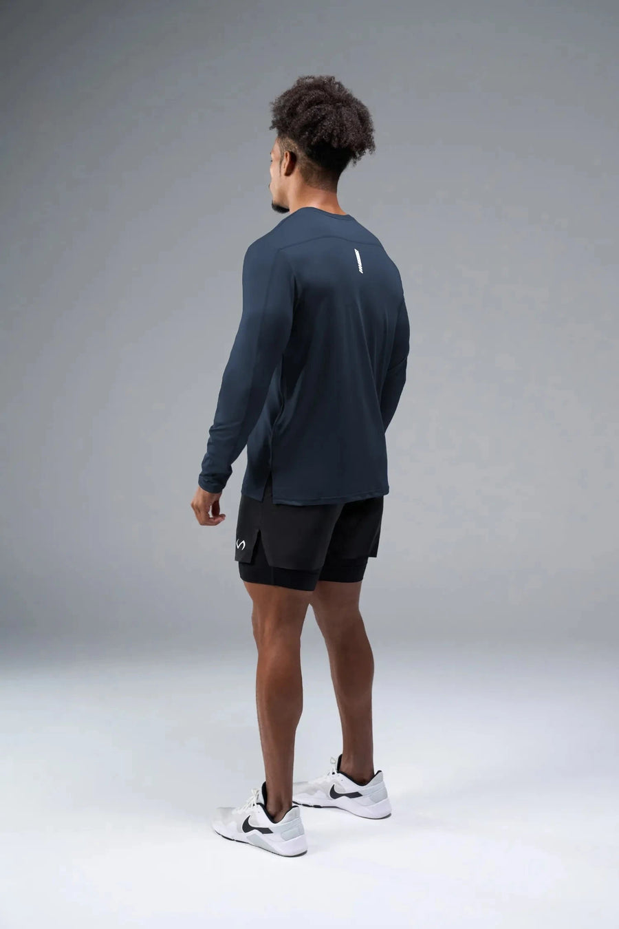 Side View of Blue TLF Infi-Dry Long Sleeve, crafted with our custom swole fit and utilizing our infi-dry fabric technology 