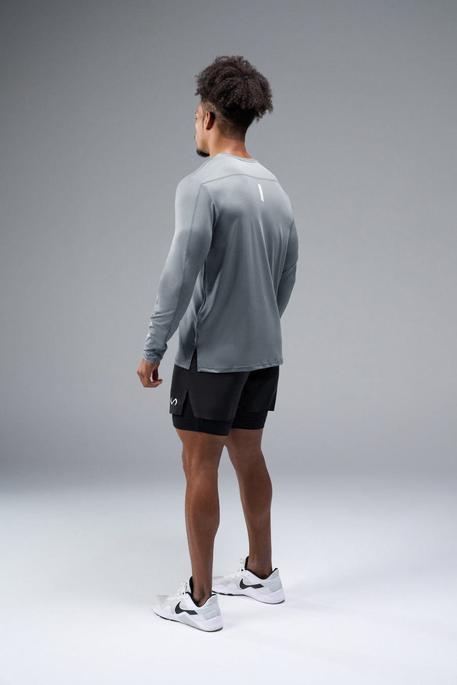 Back View of Gray TLF Train Infi-Dry Long Sleeve, featuring our Infi-Dry fabric technology and reflective sleeve design for night running 