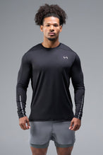 Front View of Black TLF Train Infi-Dry Long Sleeve, featuring our Infi-Dry fabric technology and reflective sleeve design for night running 