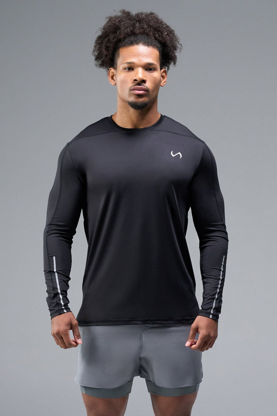 Front View of Black TLF Train Infi-Dry Long Sleeve, featuring our Infi-Dry fabric technology and reflective sleeve design for night running 