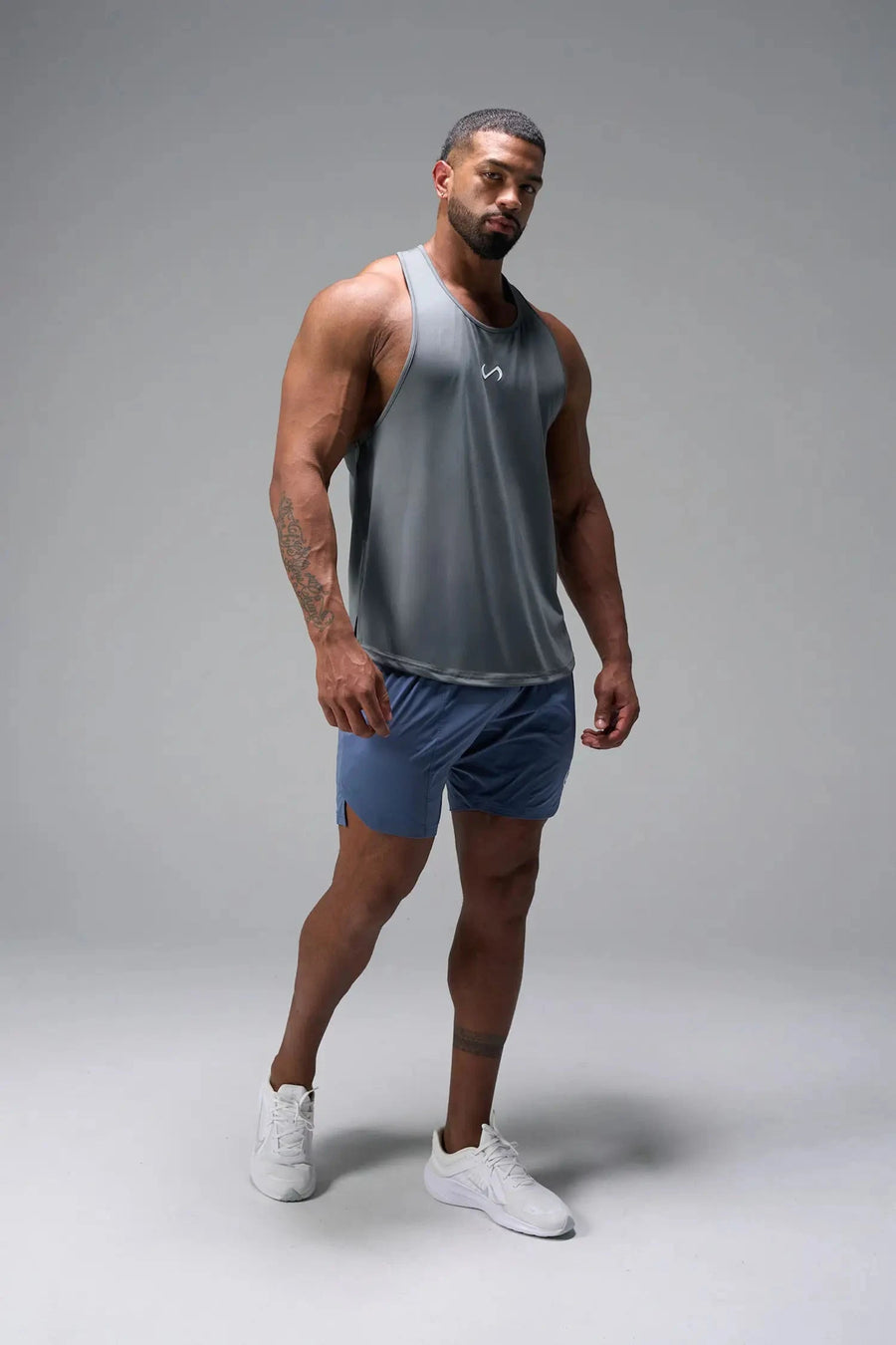 Front View of Gray TLF Infi Dry Stringer Tank featuring a physique enhancing design in our advanced Infi-Dry DNA fabric technology