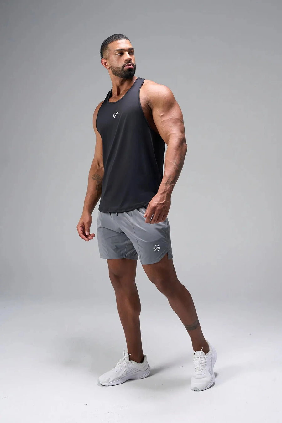 Front View of Black TLF Infi Dry Stringer Tank featuring a physique enhancing design in our advanced Infi-Dry DNA fabric technology