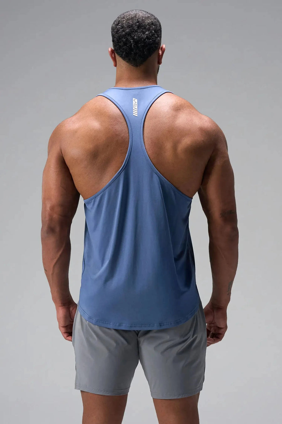 Back View of Blue TLF Infi Dry Stringer Tank featuring a physique enhancing design in our advanced Infi-Dry DNA fabric technology