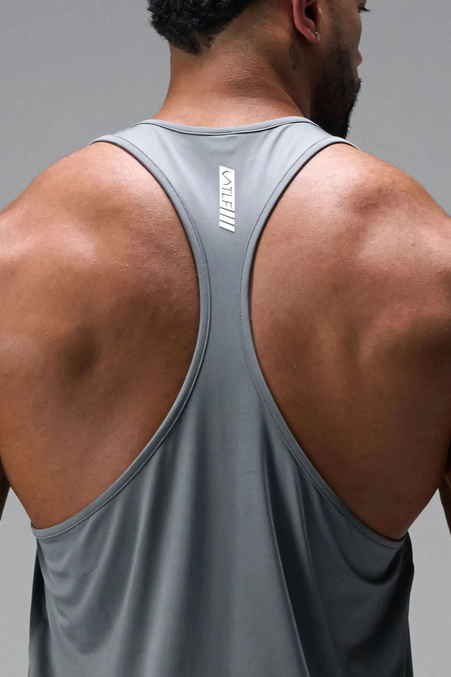 Back View of Gray TLF Infi Dry Stringer Tank featuring a physique enhancing design in our advanced Infi-Dry DNA fabric technology