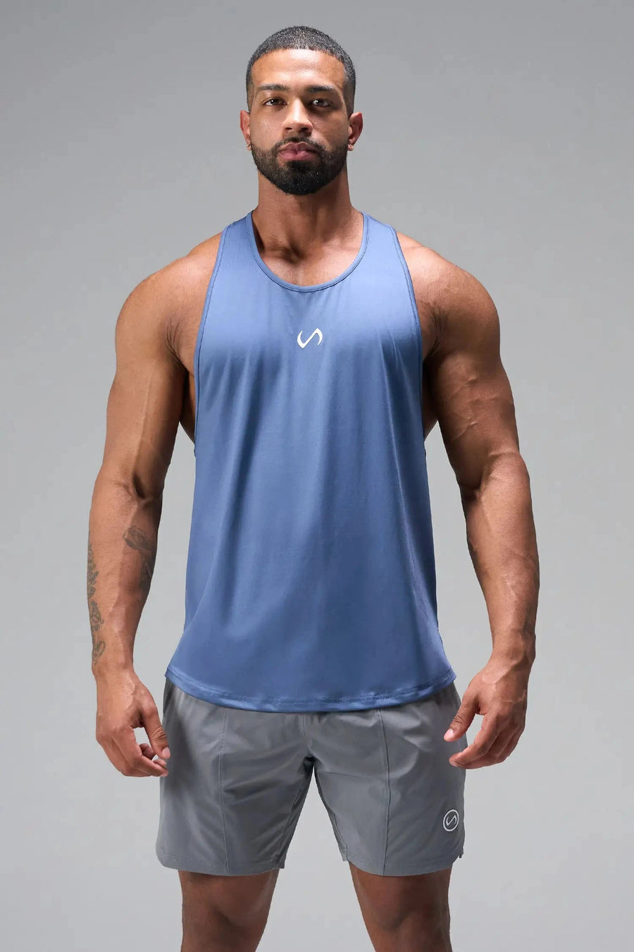 Front View of Blue TLF Infi Dry Stringer Tank featuring a physique enhancing design in our advanced Infi-Dry DNA fabric technology